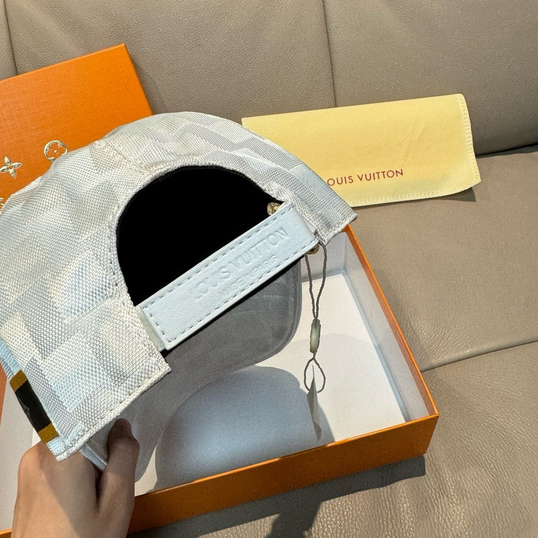 Louis Vuitton cap side view with black inner lining and light gray-blue check fabric