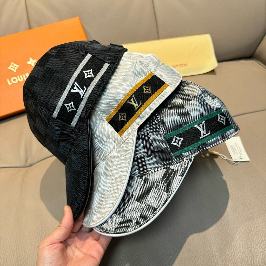 Louis Vuitton black-and-gray patterned cap with white logo band and green patch