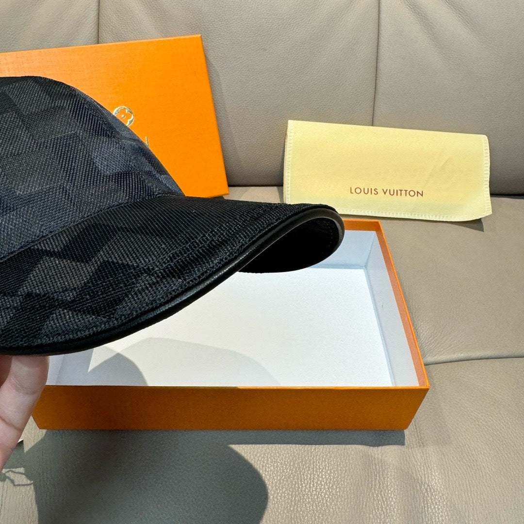 Louis Vuitton black baseball cap brim close-up, showing textured fabric and stitching