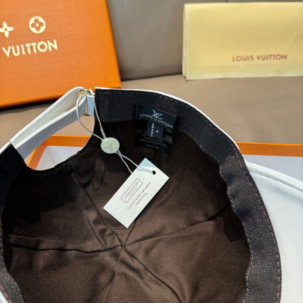 Black interior of a cap with adjustable strap and product label tag