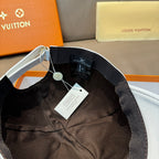 Black interior of a cap with adjustable strap and product label tag