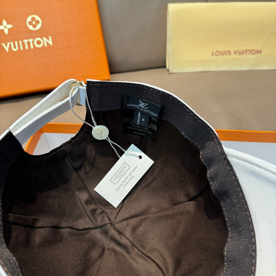 Black interior of a cap with adjustable strap and product label tag