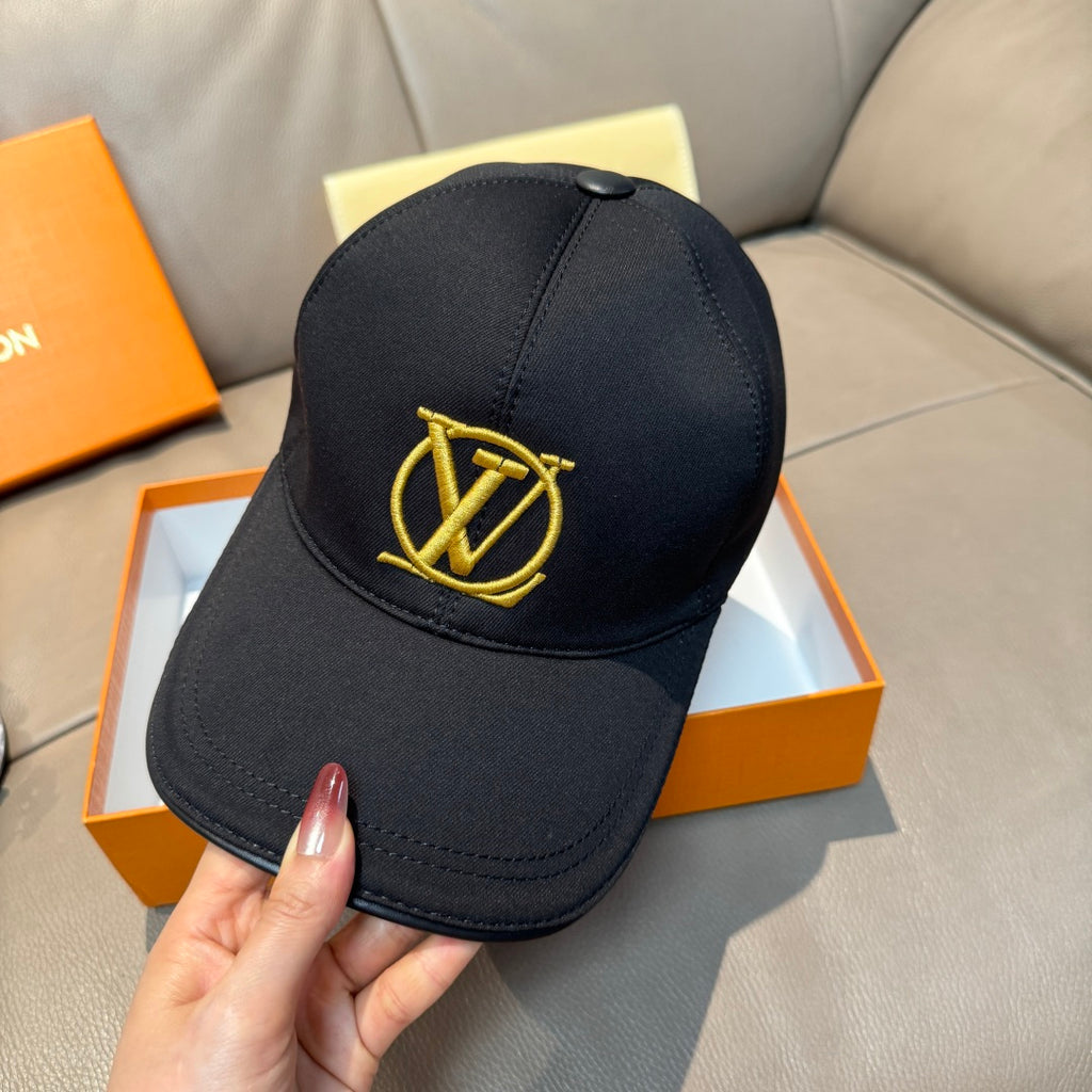 Louis Vuitton black baseball cap with gold LV logo on the front