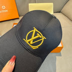 Louis Vuitton black cap close-up with gold LV logo embroidery on the front