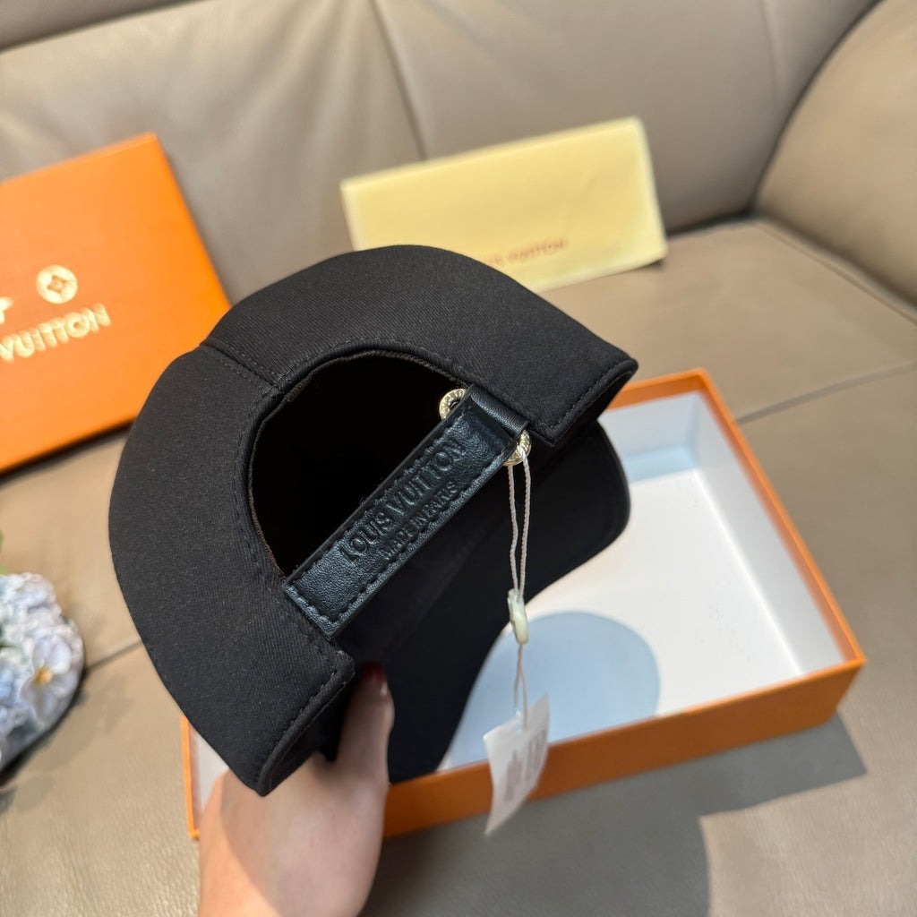 Louis Vuitton black cap underside with strap detail and hanging tag