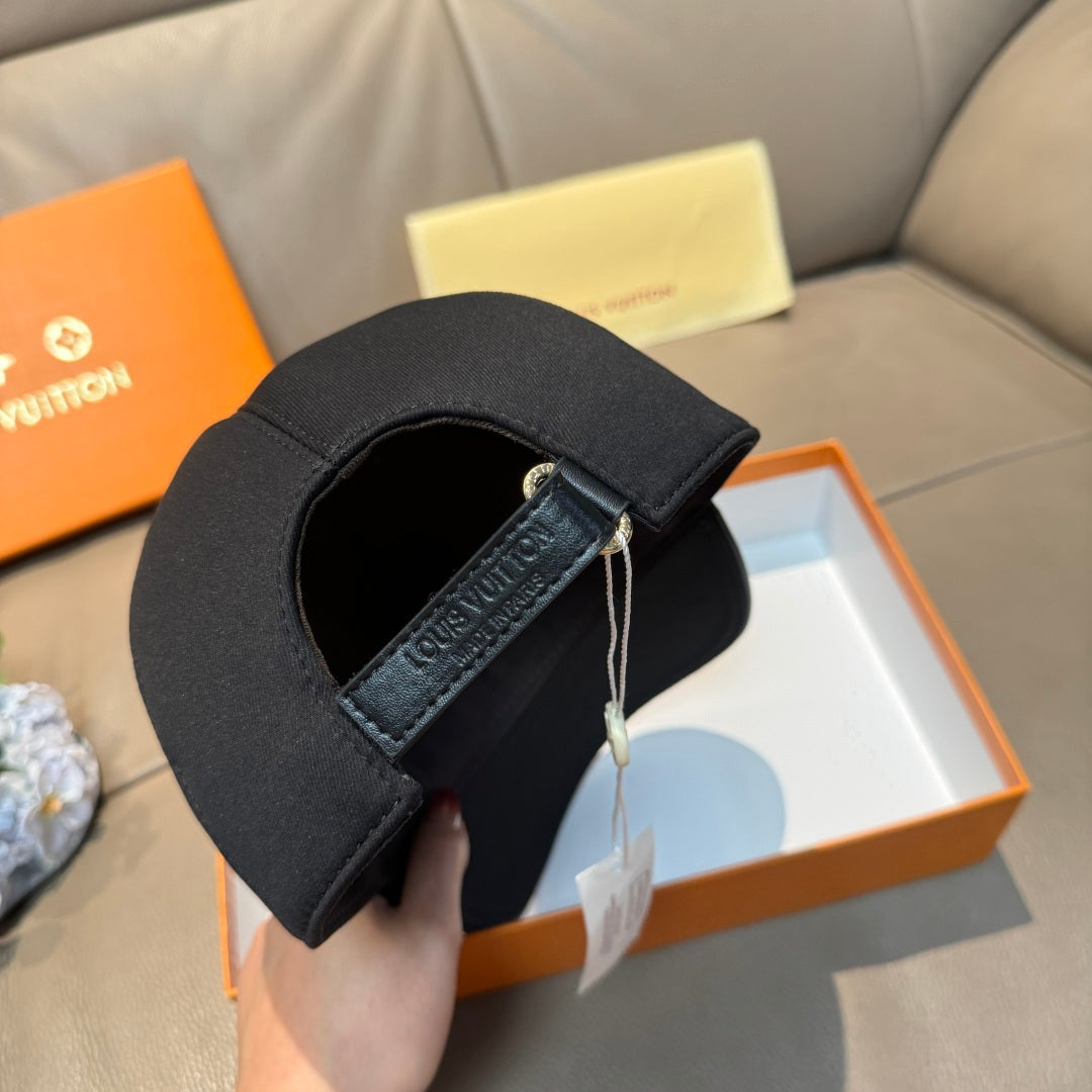 Louis Vuitton black cap underside with strap detail and hanging tag