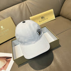 Light blue baseball cap with curved brim and front logo patch, angled view