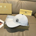 Light blue baseball cap with stitched brim and round logo patch on front