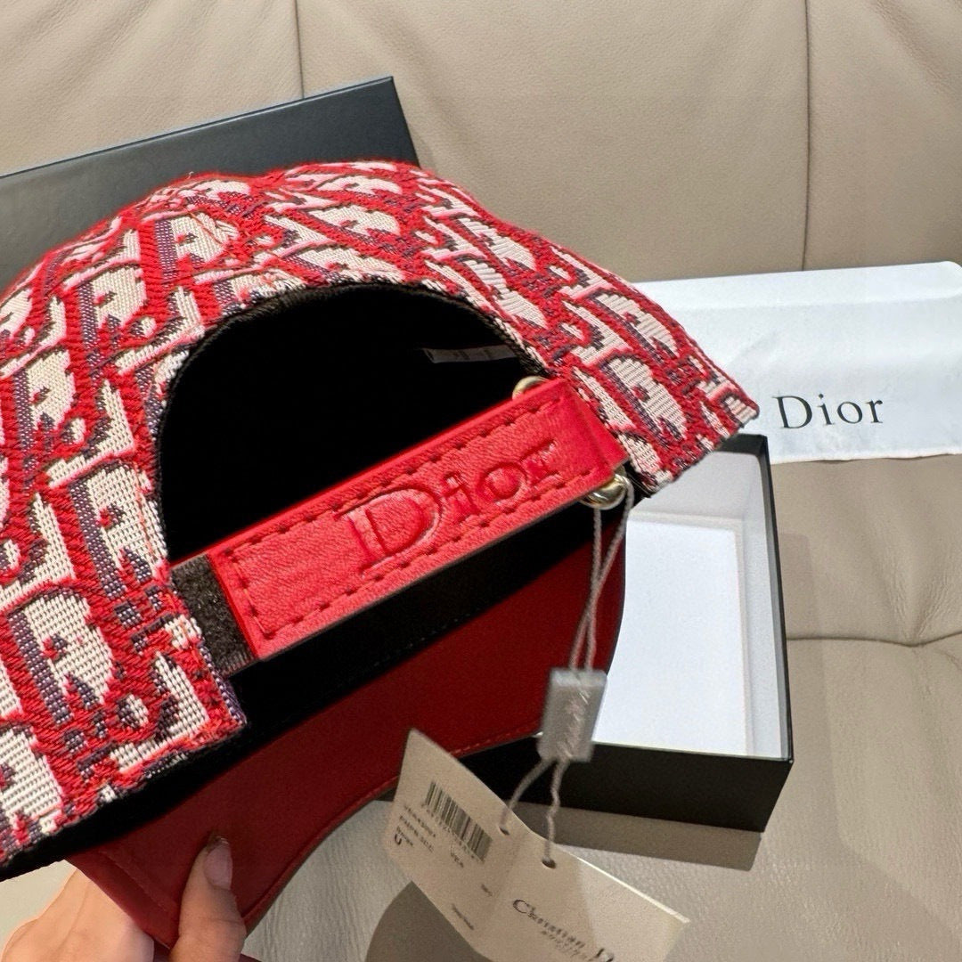 Dior monogram cap with interior black lining and red leather side strap detail