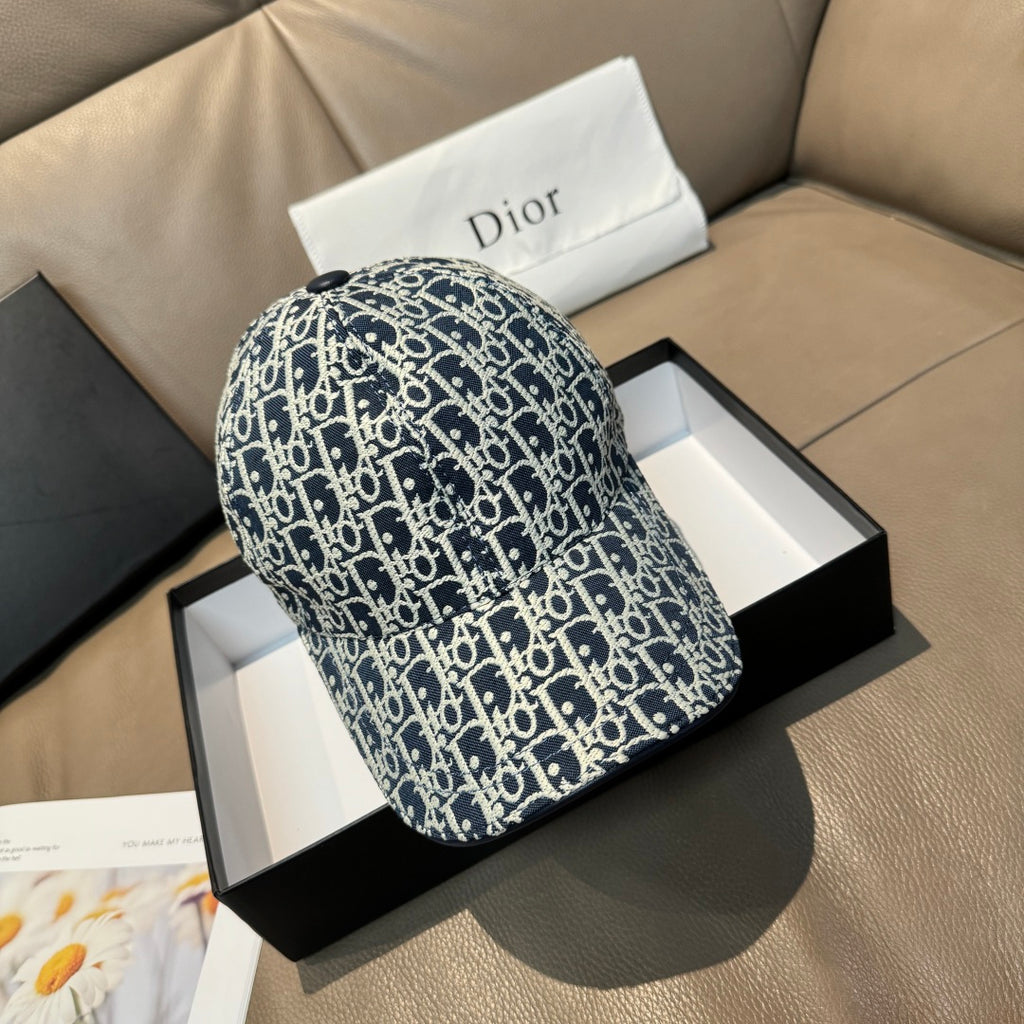 Dior cap in navy with white repeating logo pattern, curved brim and top panel.