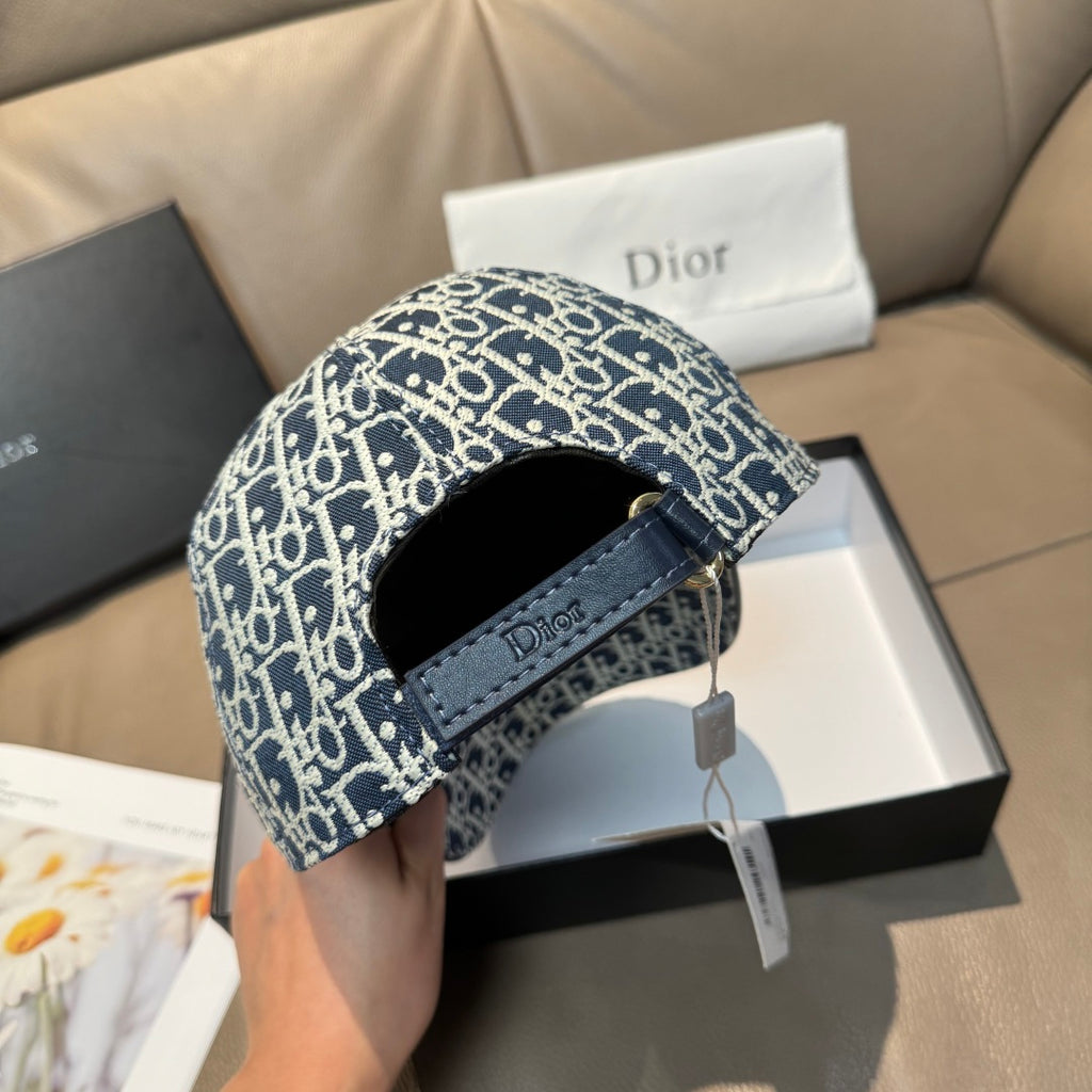 Navy-and-white logo cap side view with adjustable strap and Dior-branded patch.