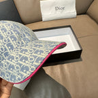 Light blue monogram cap brim with pink underside trim detail