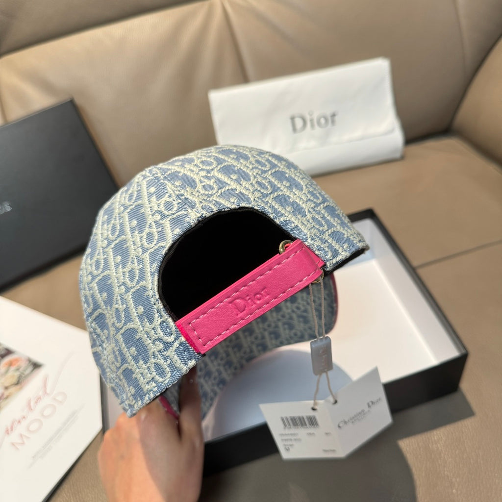 Light blue monogram cap with pink leather strap and adjustable buckle on side