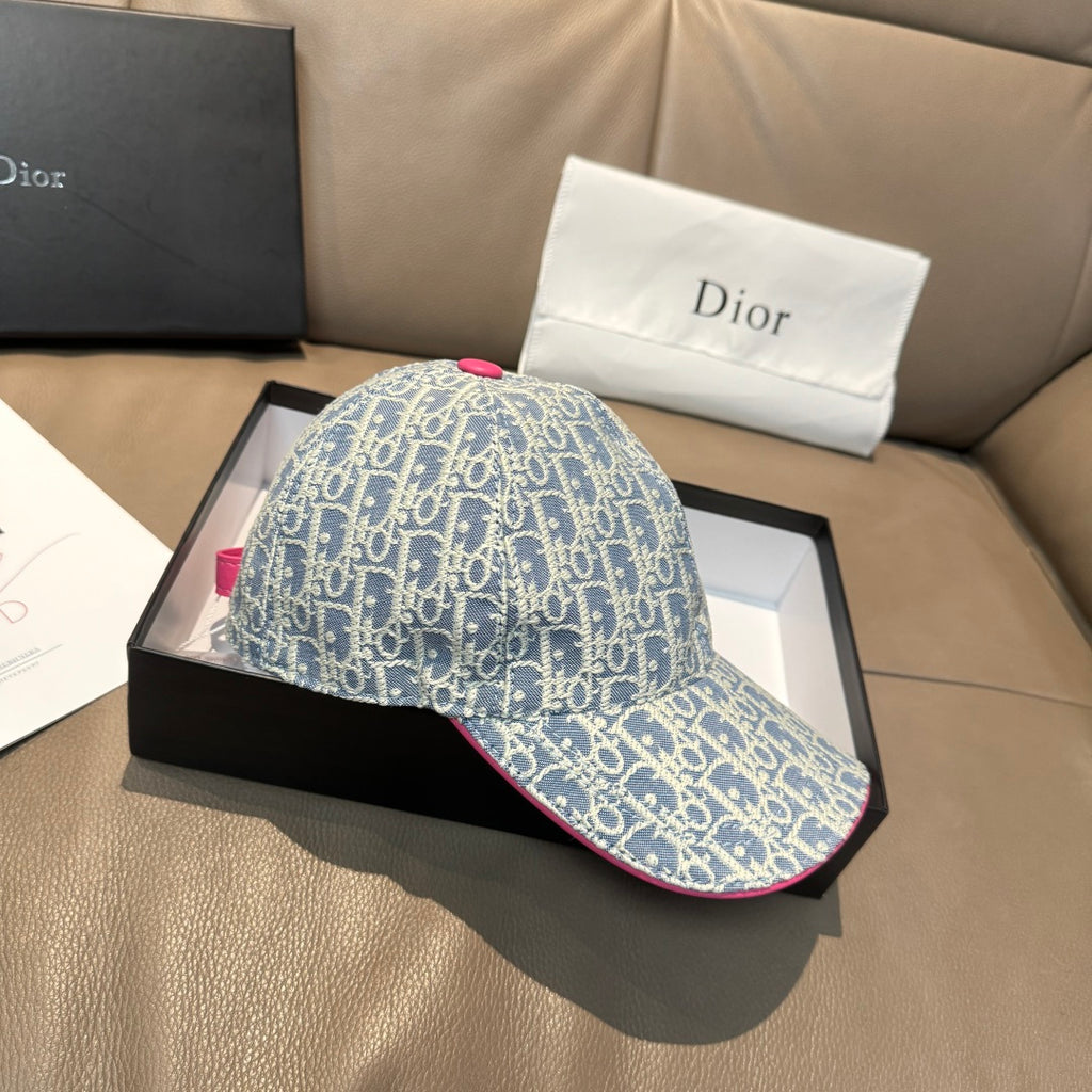 Light blue monogram baseball cap shown from the side with pink-trim brim edge