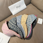 Set of Dior monogram baseball caps in beige, navy, blue, and pink