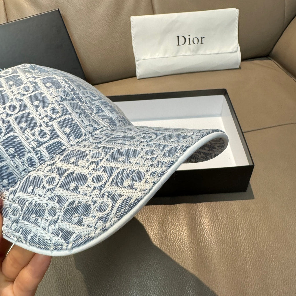 Light blue monogram baseball cap with fabric texture and underside of the brim.