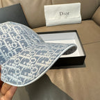 Light blue monogram baseball cap with fabric texture and underside of the brim.
