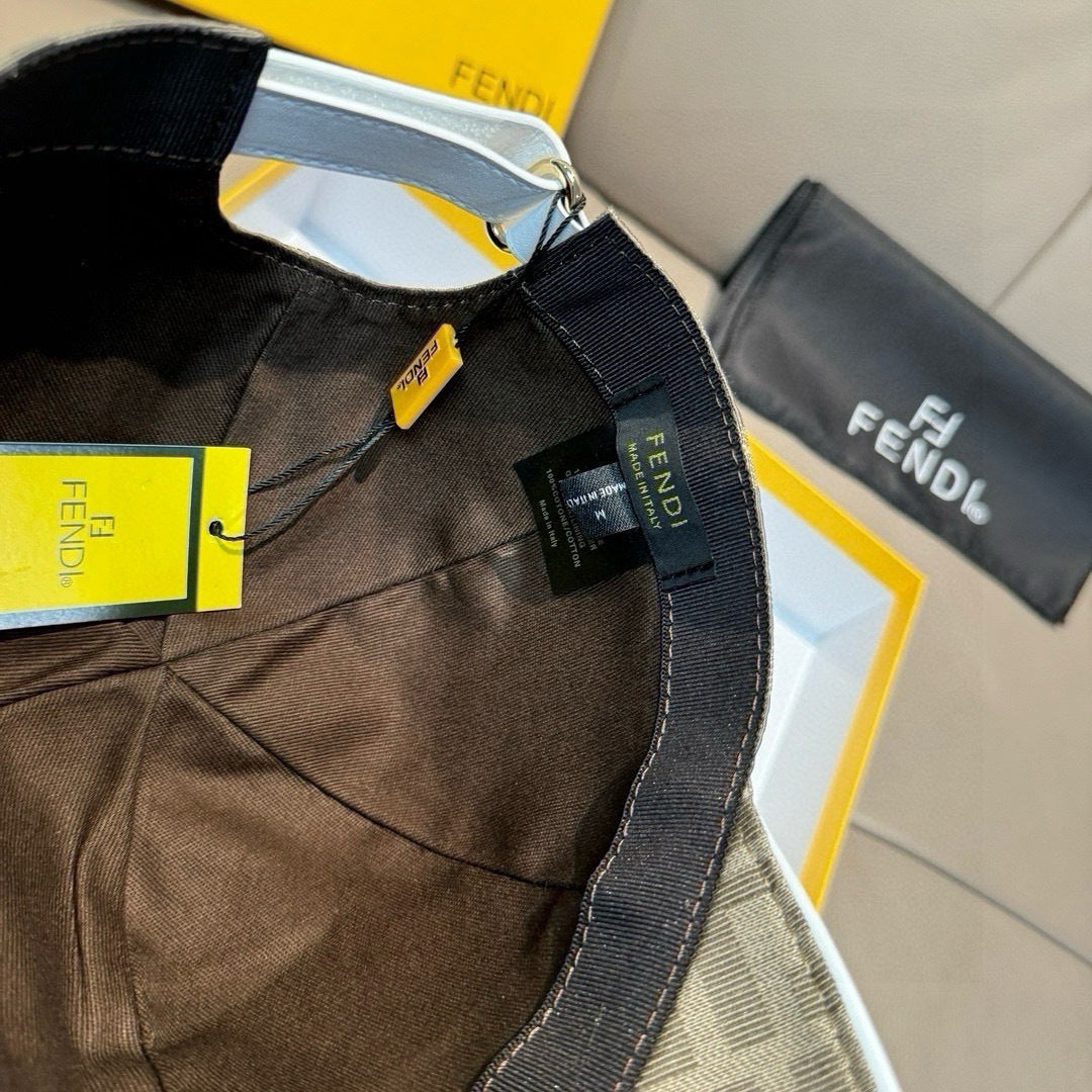 Fendi cap in dark brown FF logo fabric, adjustable strap and hang tag on side.