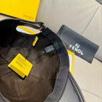 Black cap with adjustable strap and tags, interior lining visible