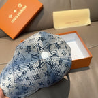Louis Vuitton denim-blue cap top with round button and monogram print