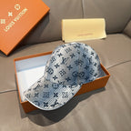 Louis Vuitton denim-blue cap with curved brim and monogram pattern