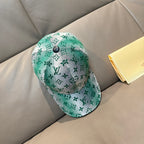 Louis Vuitton baseball cap with green monogram print and dark adjustable strap button