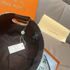 Louis Vuitton cap interior with black strap, hanging tag, and adjustable closure
