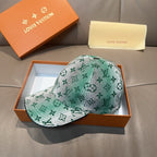 Louis Vuitton baseball cap, green and white monogram pattern with curved brim