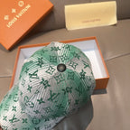 Louis Vuitton baseball cap close-up showing green monogram print and round top button