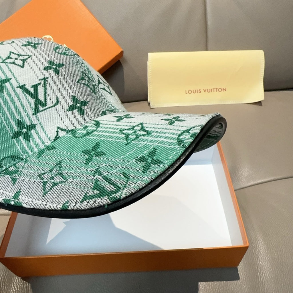 Louis Vuitton baseball cap side view with green monogram fabric and dark brim edge