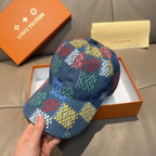 Multicolor patchwork baseball cap, blue crown with a black button at top