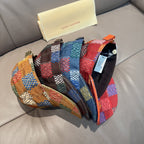 Patchwork plaid cap with curved brim and multicolor side panels