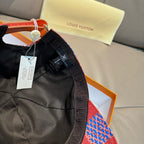 Louis Vuitton cap with black interior, multicolor brim, hanging tags and strap