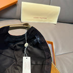 Louis Vuitton cap interior, black lining with hanging size tag and loop