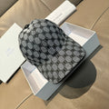 Balenciaga cap in gray and black monogram fabric, curved brim, side profile view.
