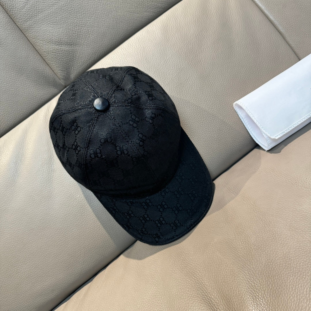 Balenciaga cap in dark monogram fabric with round button on crown, side view