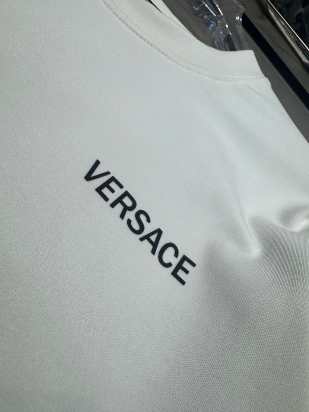 White long-sleeve T-shirt with VERSACE text logo
