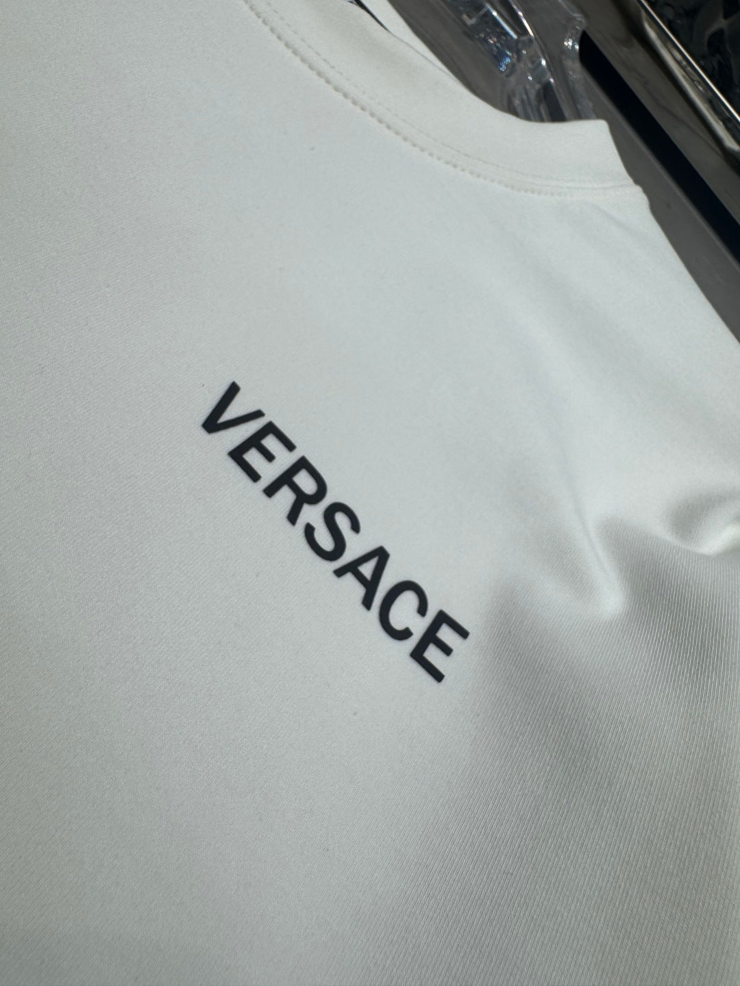 White long-sleeve T-shirt with VERSACE text logo