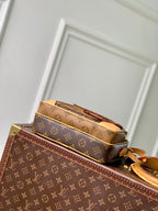 Louis Vuitton monogram canvas mini bag with tan leather handles and open top compartment