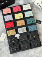 Small quilted flap wallet bags set with mixed colors, including pink, white, yellow, teal, and black.