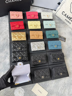 Small quilted flap wallet bags set in pink, red, white, yellow, teal, gold, and black.