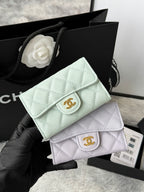 Light mint quilted flap small bag with gold logo clasp and chain strap