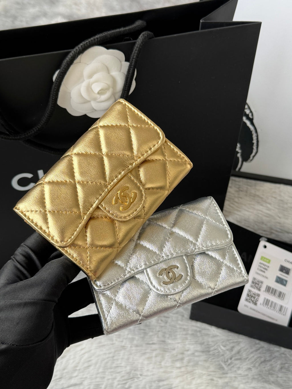 Gold quilted flap small bag with gold logo clasp and chain strap