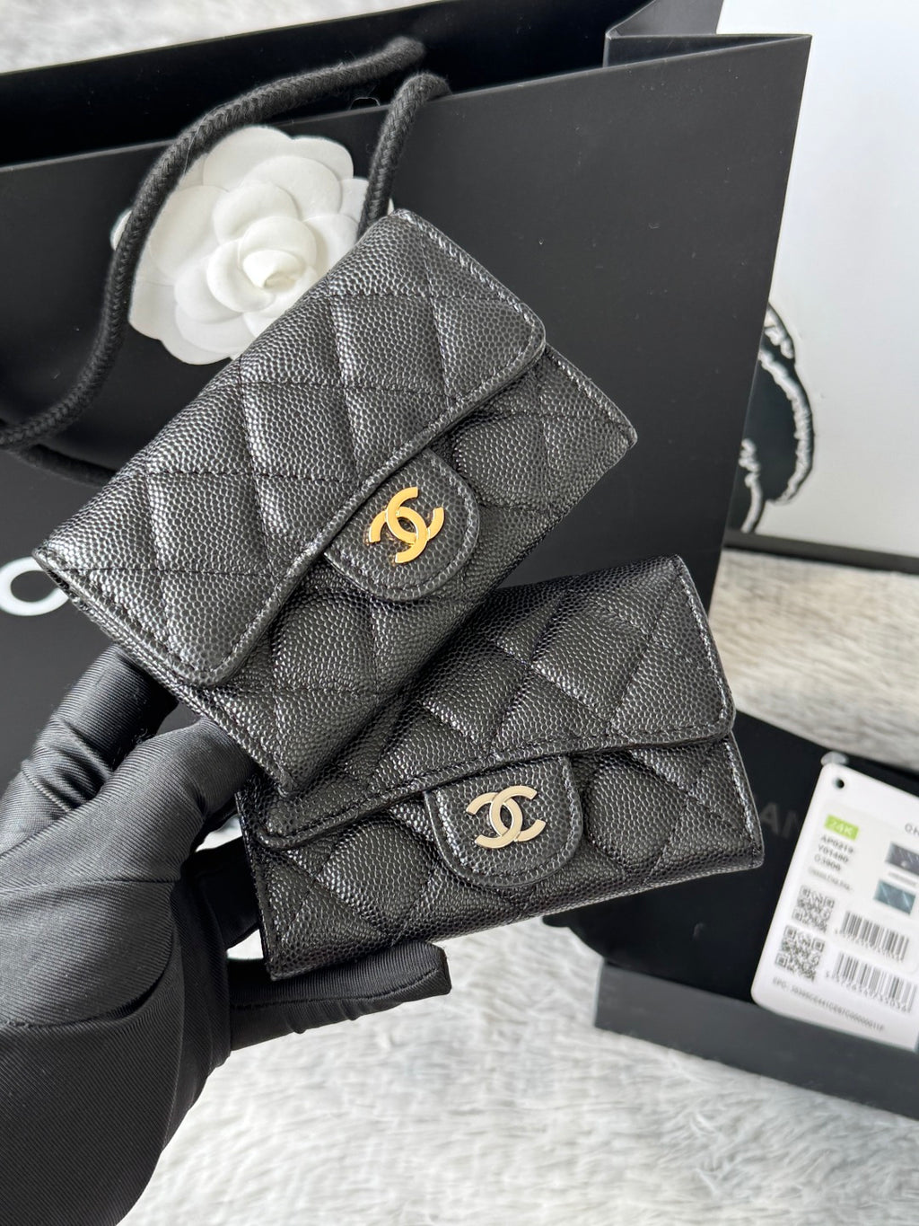 Dark gray quilted flap small bag with gold logo clasp and chain strap