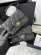 Dark gray quilted flap small bag with gold logo clasp and chain strap
