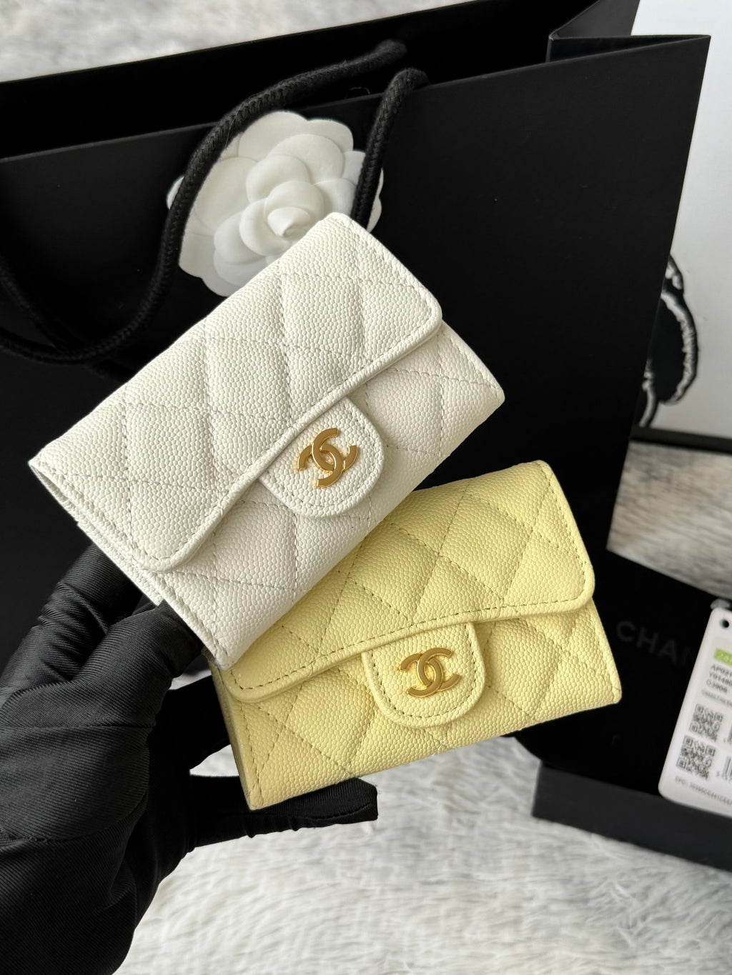 White quilted flap small bag with gold logo clasp and chain strap
