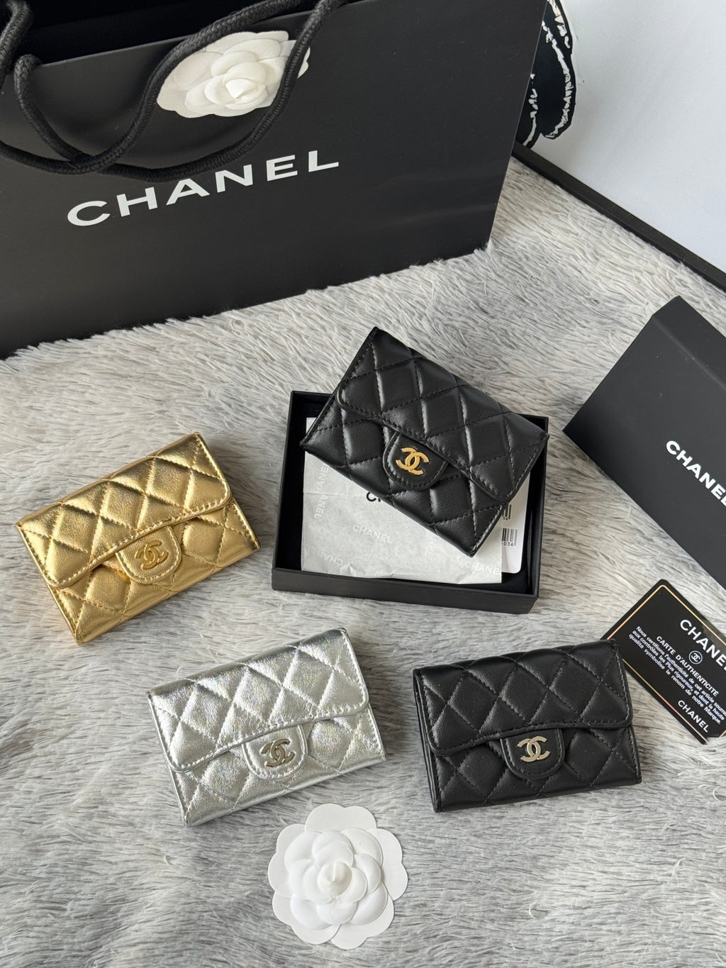 Quilted mini flap bags in gold, black, silver, and dark teal with logo emblem