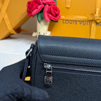 Men’s navy textured leather crossbody bag detail with front zipper and LV charm.