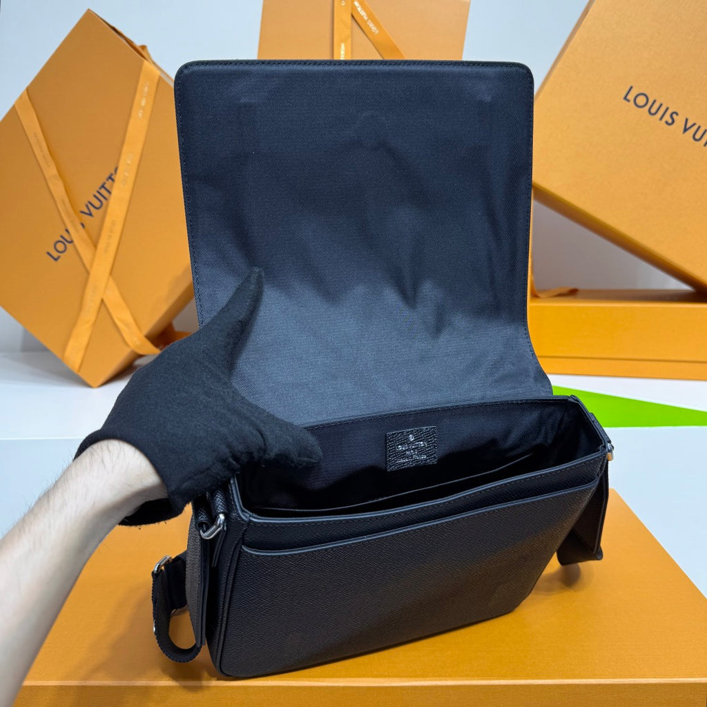 Louis Vuitton dark blue crossbody bag open view with top interior lining and zipper.