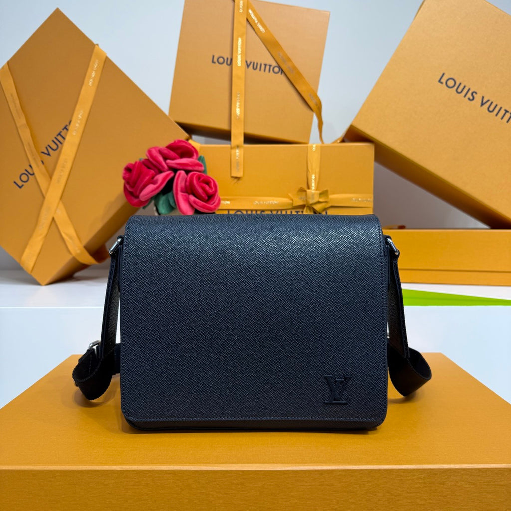 Men’s navy textured leather crossbody bag with flap and LV logo on front.
